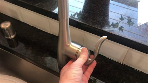 Remove the handle of the single lever faucet from the main valve screw by using a flathead screwdriver. . Remove moen single handle kitchen faucet
